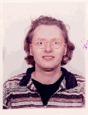 3. A picture of me wearing oval black rimmed
 
	glasses.