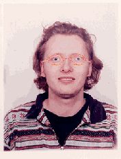 5. A picture of me wearing oval glasses with a coloured rim.